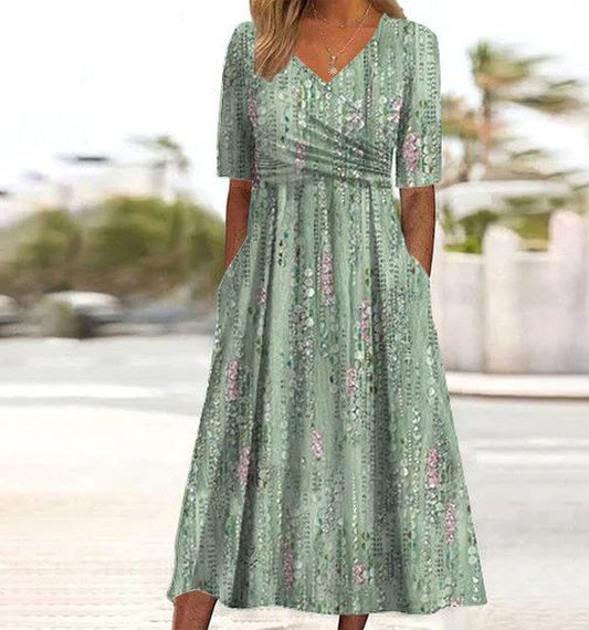 Close up view of botanical midi dress showing flattering fit and nature-inspired leaf print design