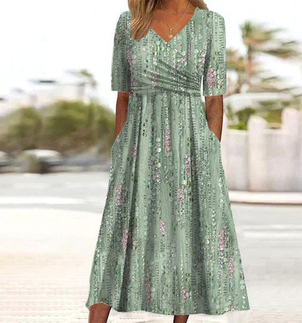 Close up view of botanical midi dress showing flattering fit and nature-inspired leaf print design